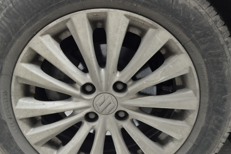 Before exterior detailing — dusty, grimy alloy wheel