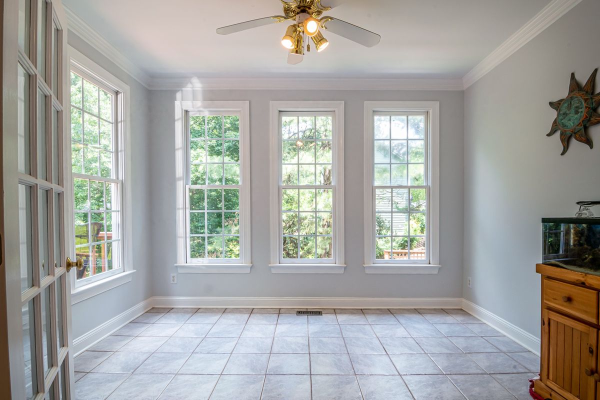 Before film installation — bright, sunlit home interior with untreated glass windows