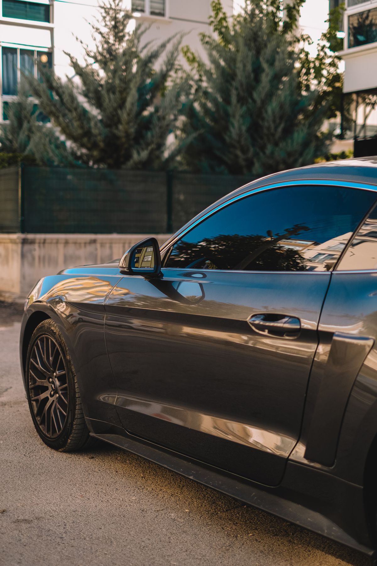 Professionally tinted car window with genuine 3M sun control film